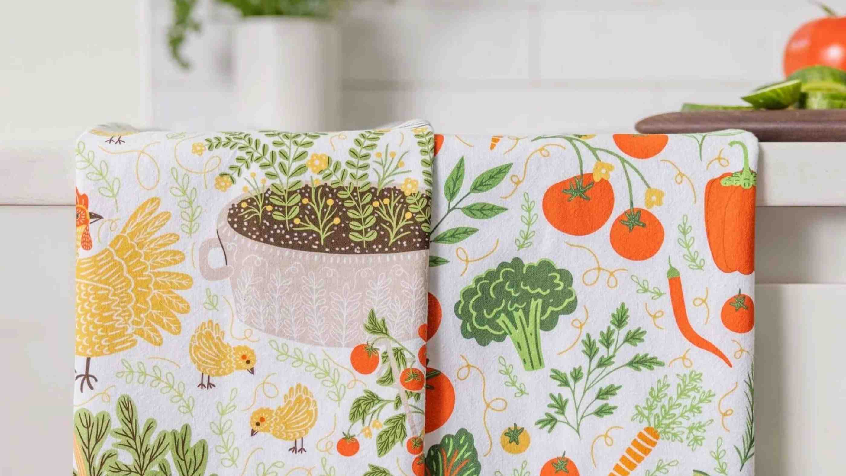 Flour sack cotton tea towel by Gingiber — folded next to linen and waffle weave samples on a marble counter