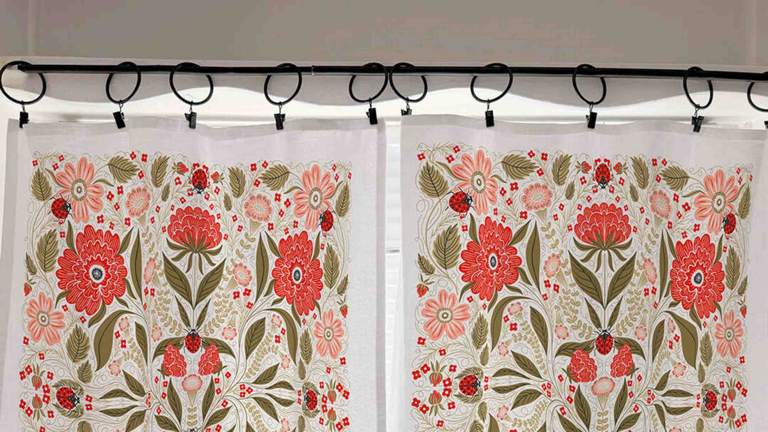 Ladybug Cafe Curtains by Gingiber hung on a tension rod in a bright kitchen window without drilling