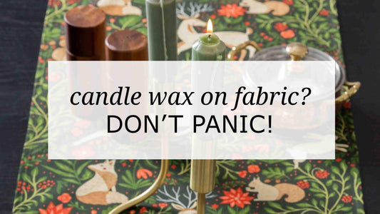 Candle wax on a patterned Gingiber table runner with green taper candles and brass holders, styled table scene with text overlay reading “Candle wax 