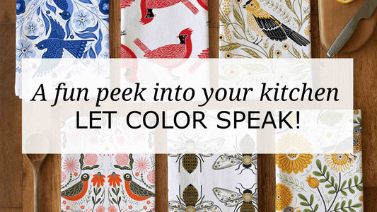 Flat lay of illustrated Gingiber tea towels in blue, red, yellow, orange, and black with birds, florals, and folk-art patterns, showcasing how color reflects kitchen personality and style.