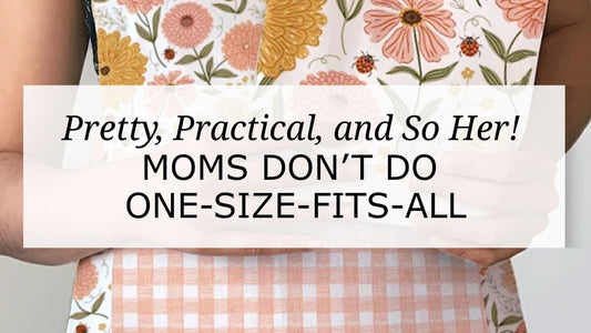 Zinnia floral apron with peach gingham pocket worn by model, overlaid with text “Pretty, Practical, and So Her! Moms Don’t Do One-Size-Fits-All,” promoting kitchen gift sets for moms.