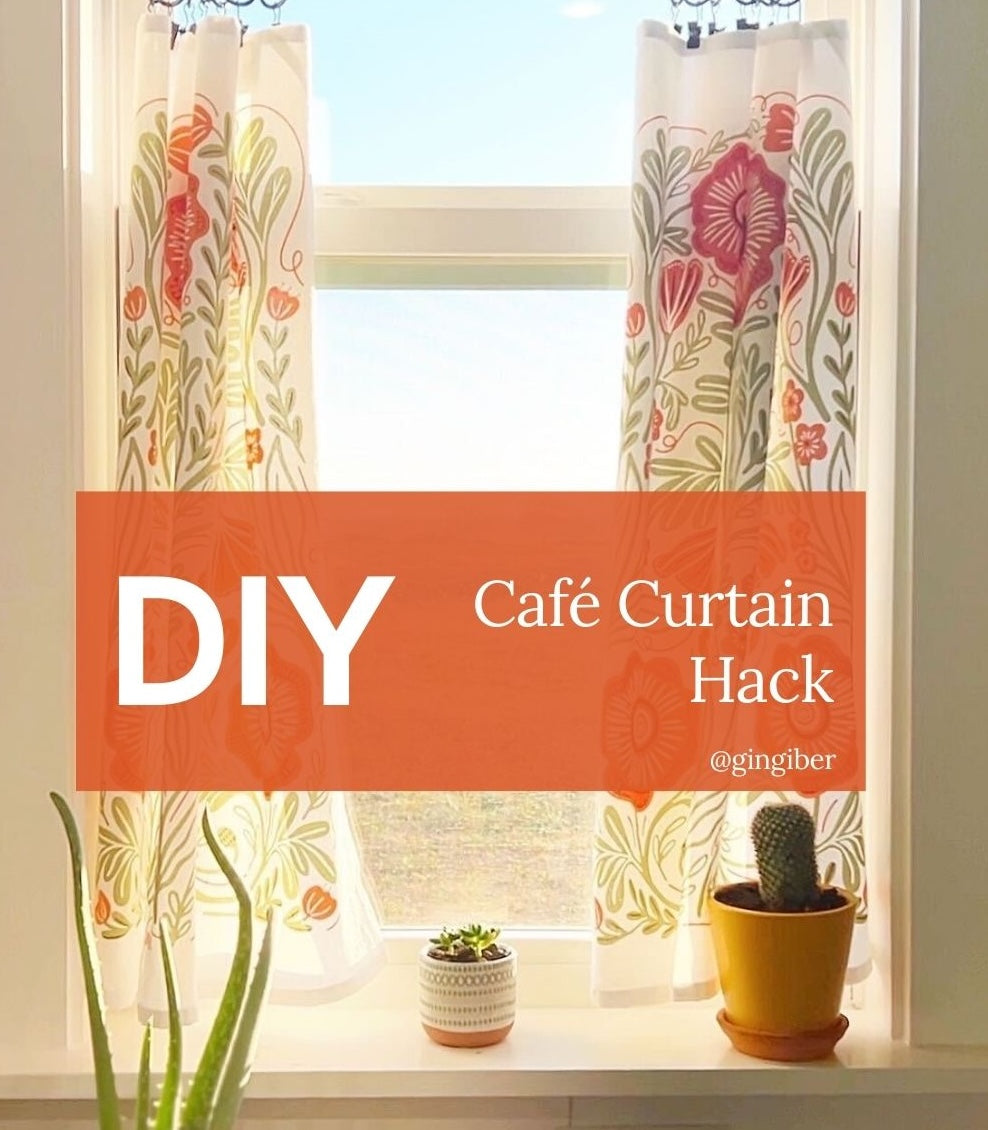 Gingiber illustrated tea towel hanging as café curtain in a bright kitchen window.