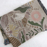 Blanket - woven throw featuring multicolored bee and beehive illustrations