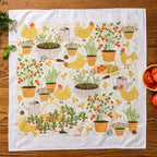 tea towel with illustrated chickens and garden items 