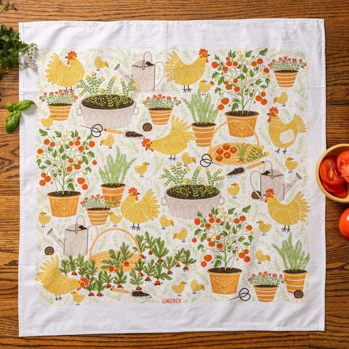 tea towel with illustrated chickens and garden items 