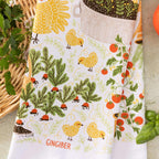 tea towel with illustrated chickens and garden items 