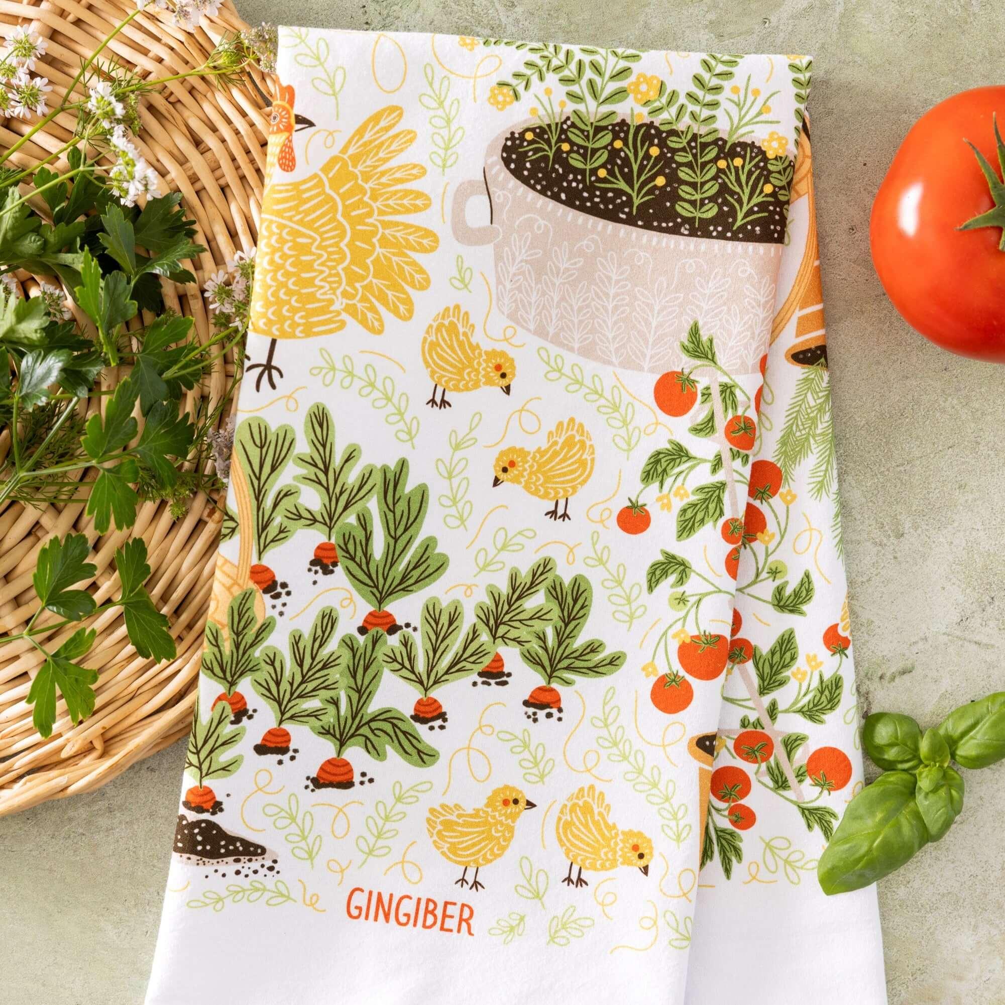 tea towel with illustrated chickens and garden items 