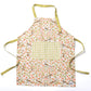 Apple Blossom Apron featuring floral design, adjustable neck strap, and large front pocket, perfect for baking.