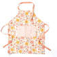 Zinnia Apron and Tea Towel Bundle featuring floral design and large pocket for kitchen use.