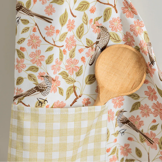 Apple Blossom Apron—bake in style with gingiber apron featuring apple blossom print, adjustable neck strap, large pocket, 100% cotton canvas