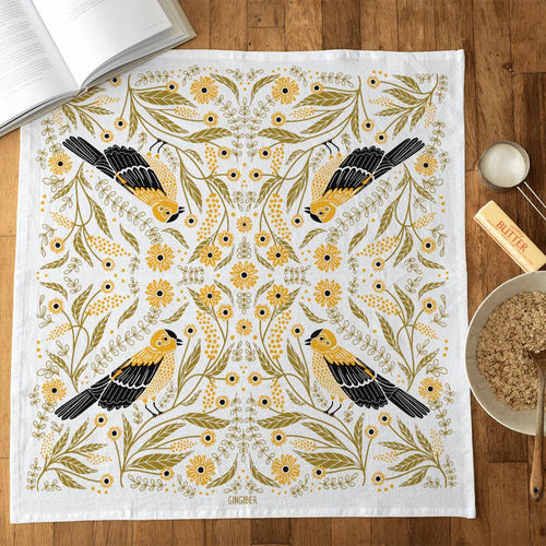 tea towel with illustrated birds and floral elements