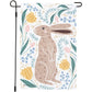 Decorative garden flag with a rabbit and floral design on a white background