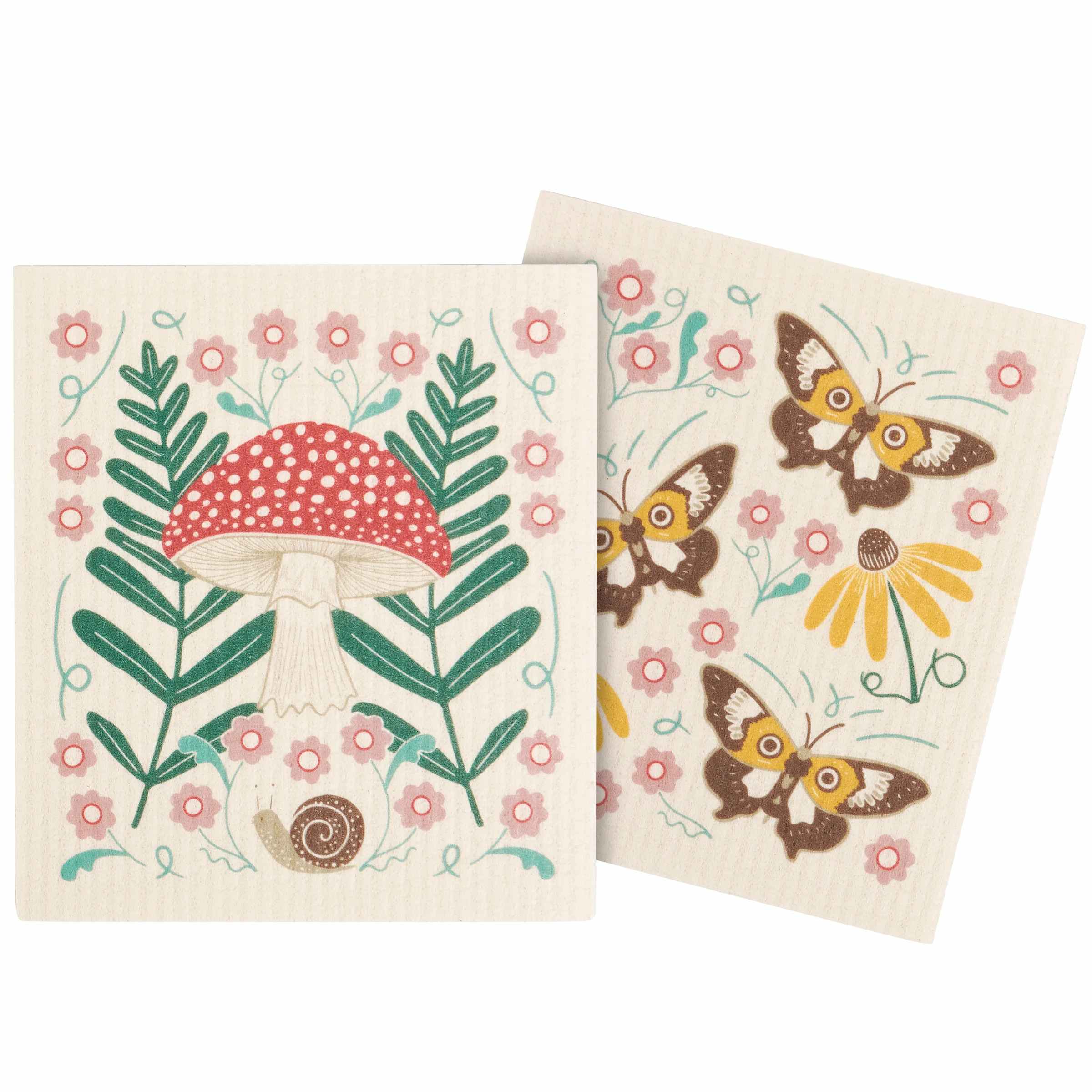 Two square cream-colored kitchen towels with whimsical nature illustrations, including a red and white mushroom, green leaves, pink flowers, yellow flowers, and brown butterflies.