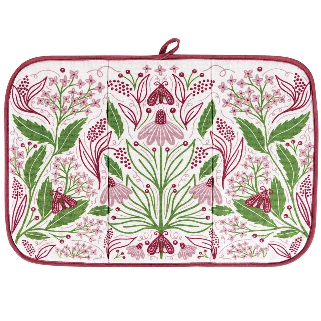 Floral patterned drying mat with green and pink design on a white background