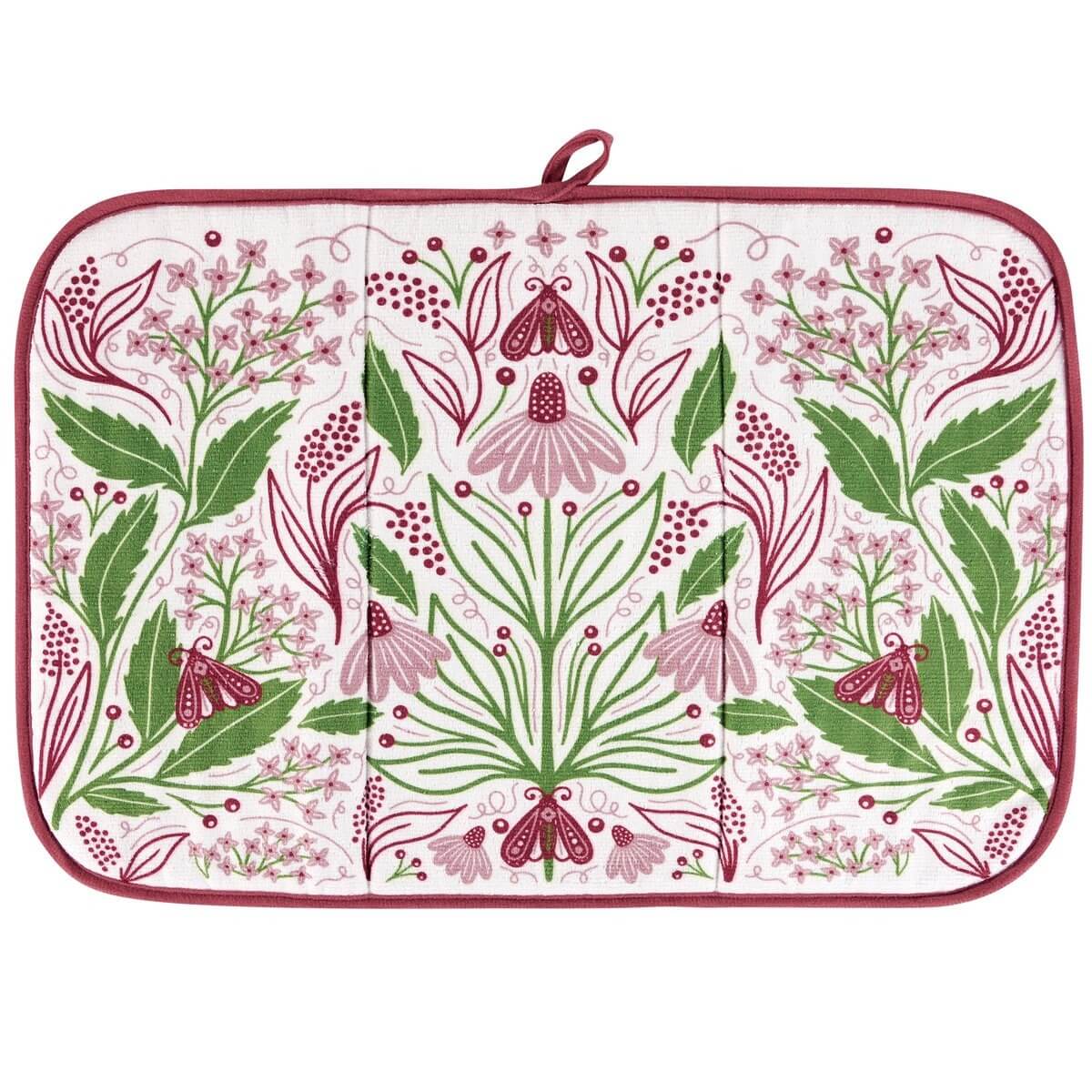 Floral patterned drying mat with green and pink design on a white background