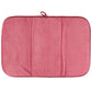 Pink textured drying mat on a white background