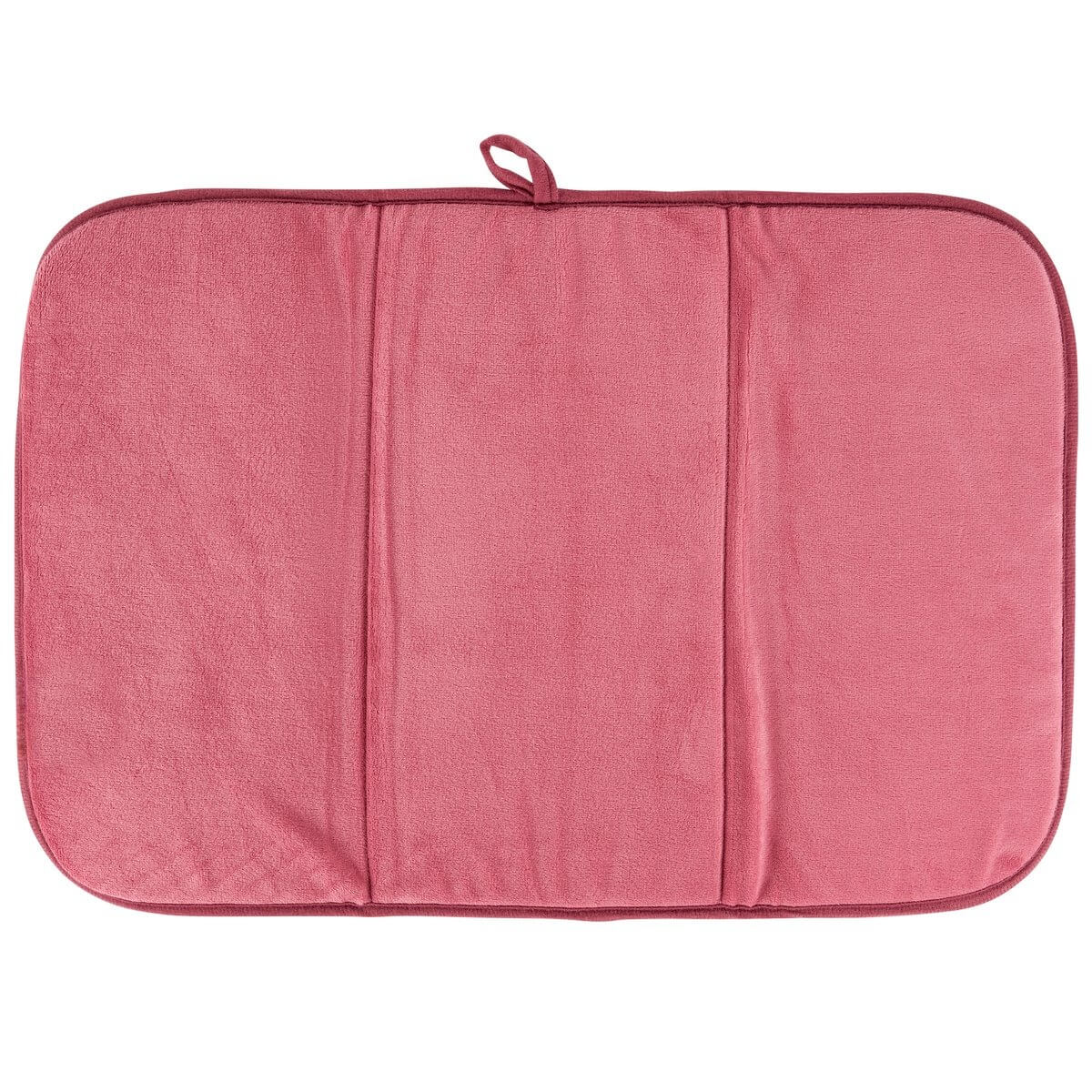 Pink textured drying mat on a white background