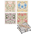 Set of four floral coasters with a holder on a white background