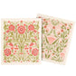 Two floral-patterned dish cloths with pink and green design on a white background