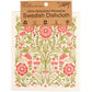 Floral patterned Swedish dishcloth with packaging label on a white background