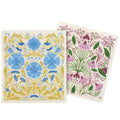 Two floral-patterned dish cloths with blue and pink flowers on a white background