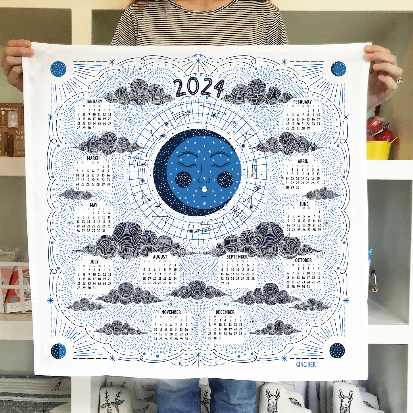 All Tea Towels Gingiber   2024TTTeaTowelHoldingMockup 