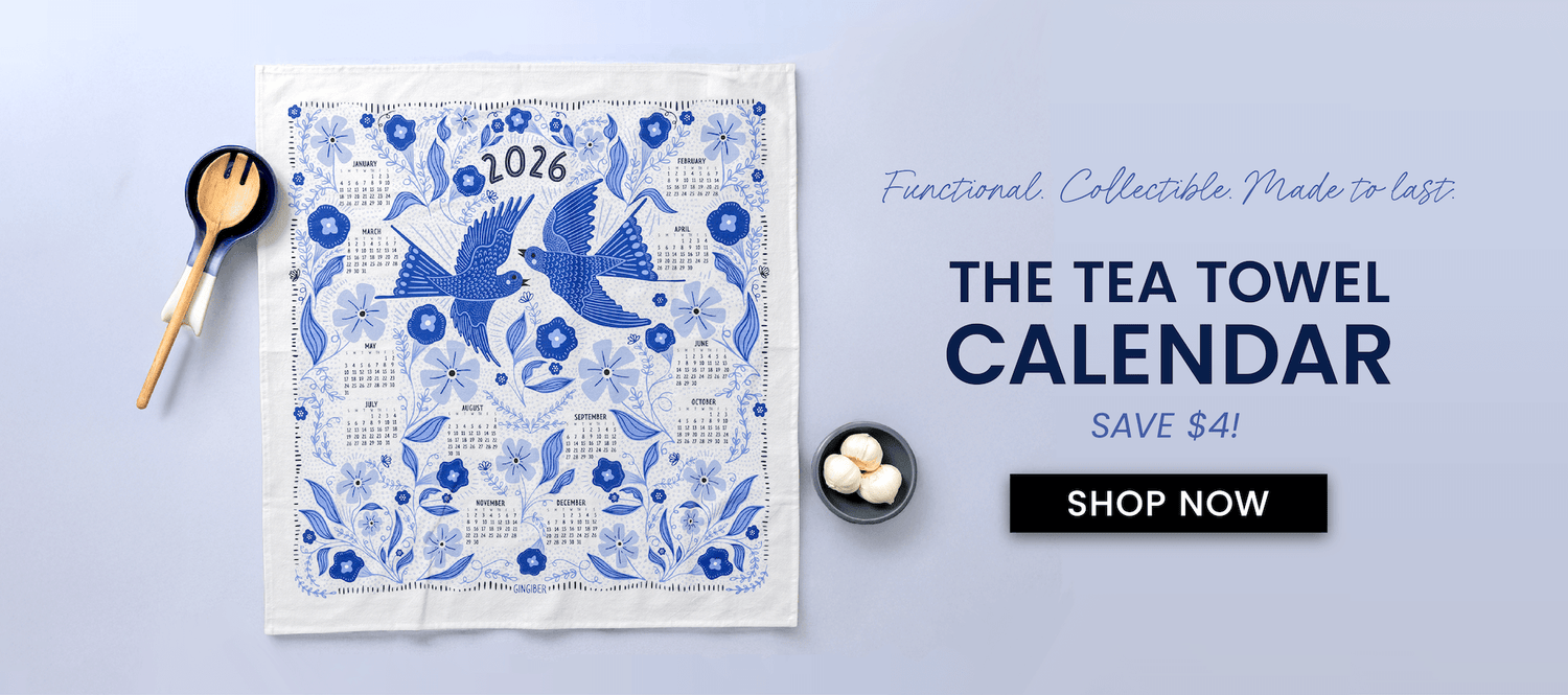 Tea towel calendar with blue bird design on a light purple background