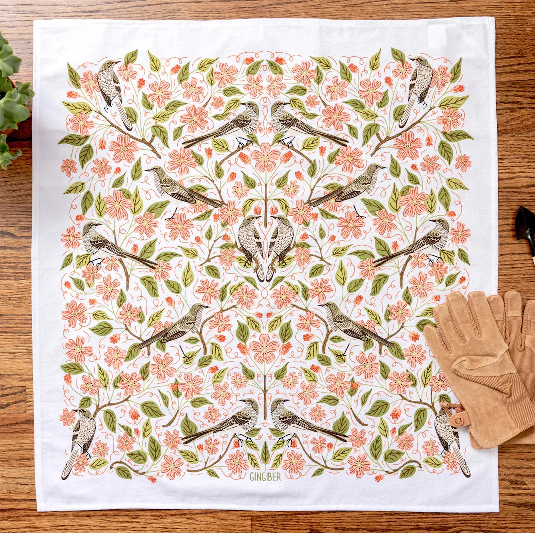 tea towel with illustrated birds and floral elements