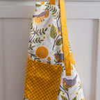 Apron - Gingiber floral apron with adjustable neck strap, large pocket, cotton canvas, 29" L x 26" W, tie back, 100% cotton, imported