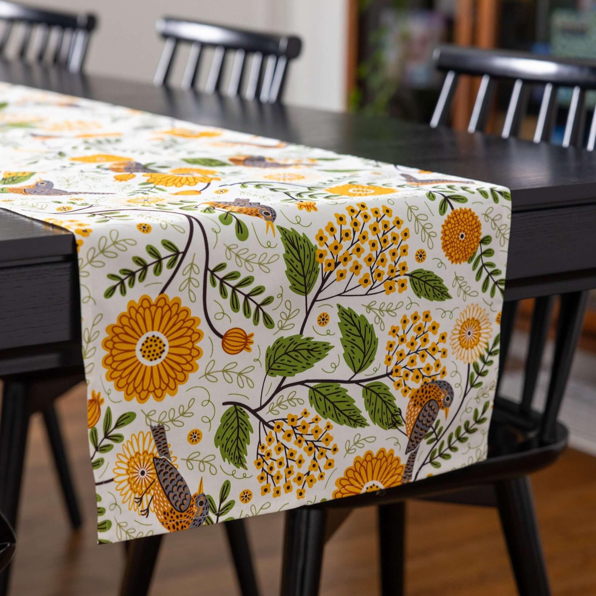 table runner with mums & robins and green gingham cloth napkins