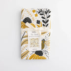 tea towel with illustrated bees and floral elements