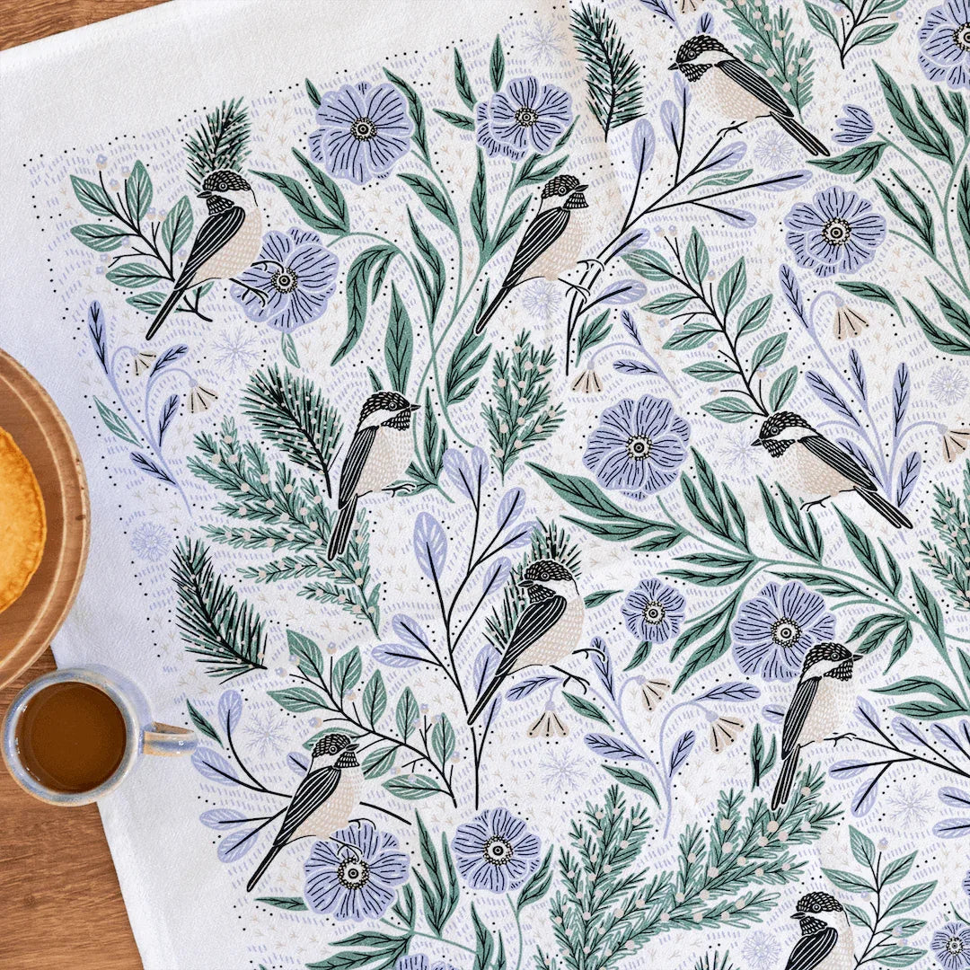 tea towel with illustrated birds and floral elements