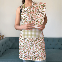 Apple Blossom Apron and Tea Towel Bundle - person wearing floral apron and matching tea towel bundle with checkered pocket, indoor setting