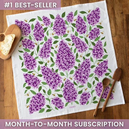 Floral patterned towel on a wooden surface with text about a subscription offer.