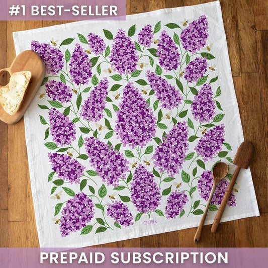 Floral patterned towel on a wooden surface with text about a subscription offer.