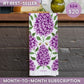 Towel with purple floral pattern on a wooden surface, with price and subscription text overlay.
