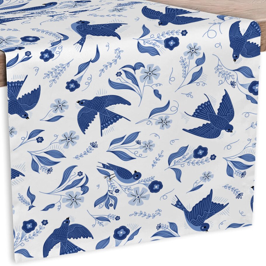 White fabric with blue bird and floral pattern