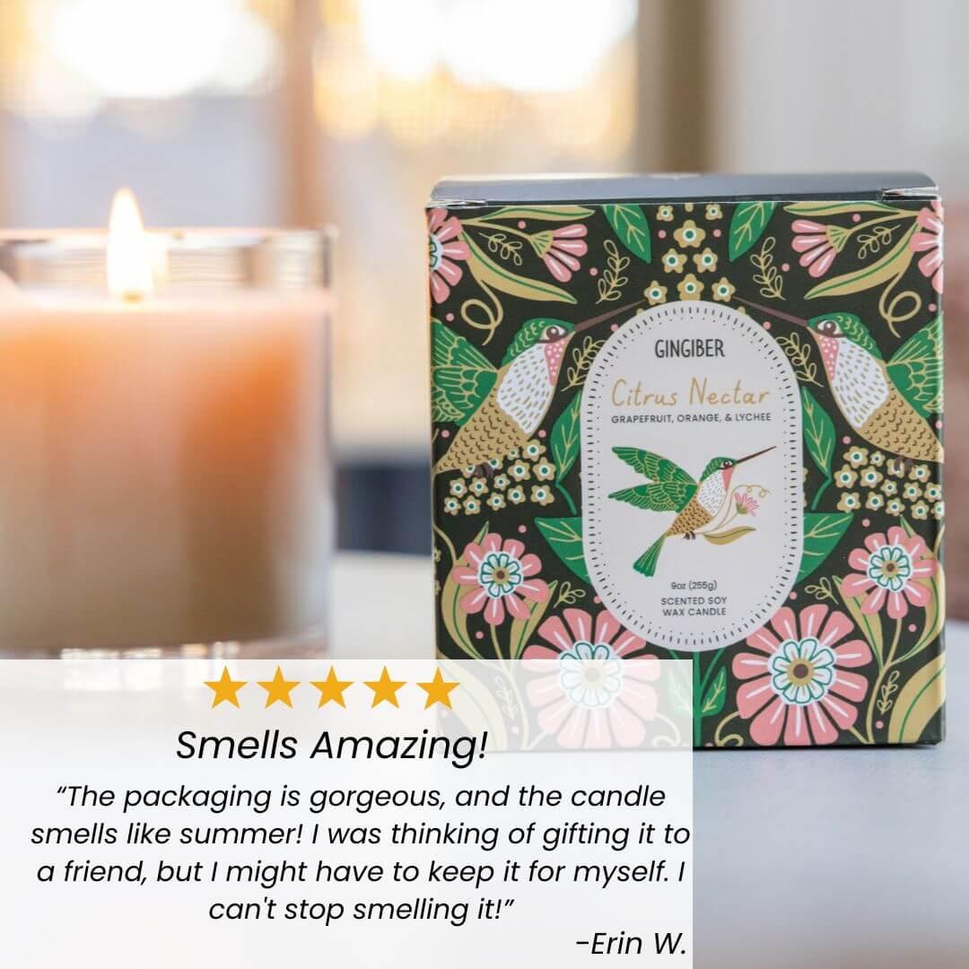 Glass cream-colored candle with green box and hummingbird illustration