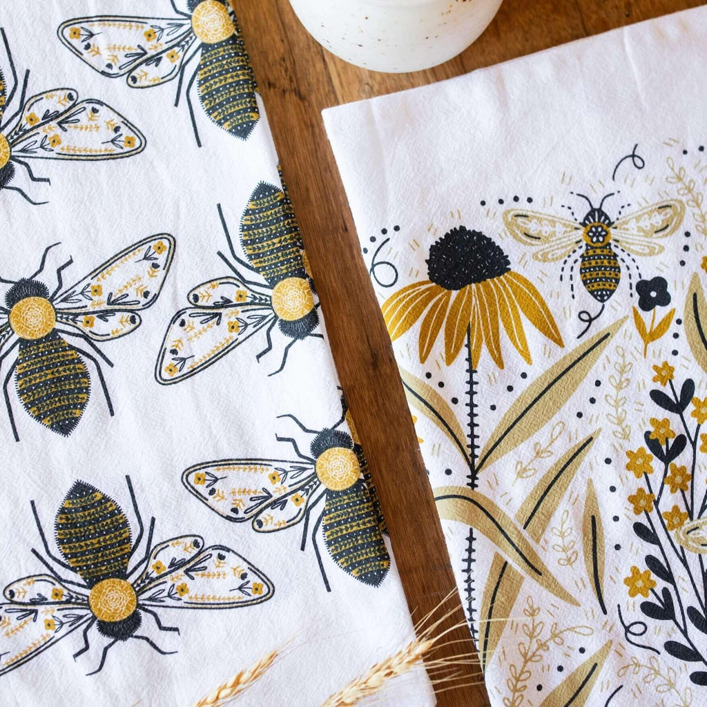 tea towel with illustrated bees and floral elements