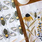 tea towel with illustrated bees and floral elements
