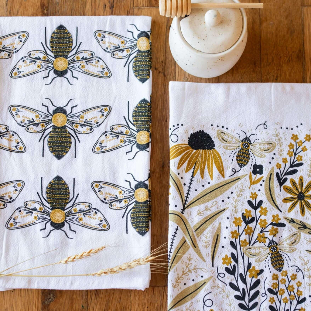 tea towel with illustrated bees and floral elements