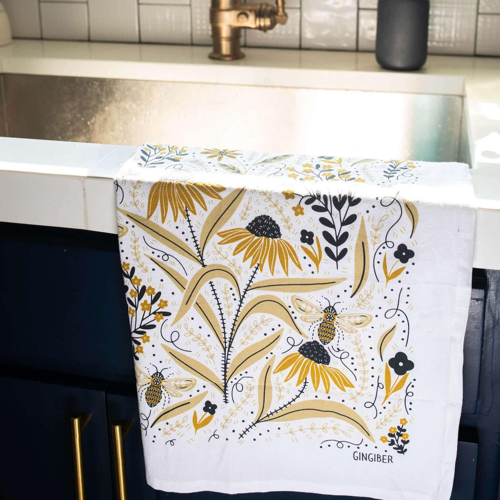tea towel with illustrated bees and floral elements