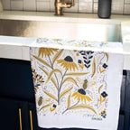 tea towel with illustrated bees and floral elements