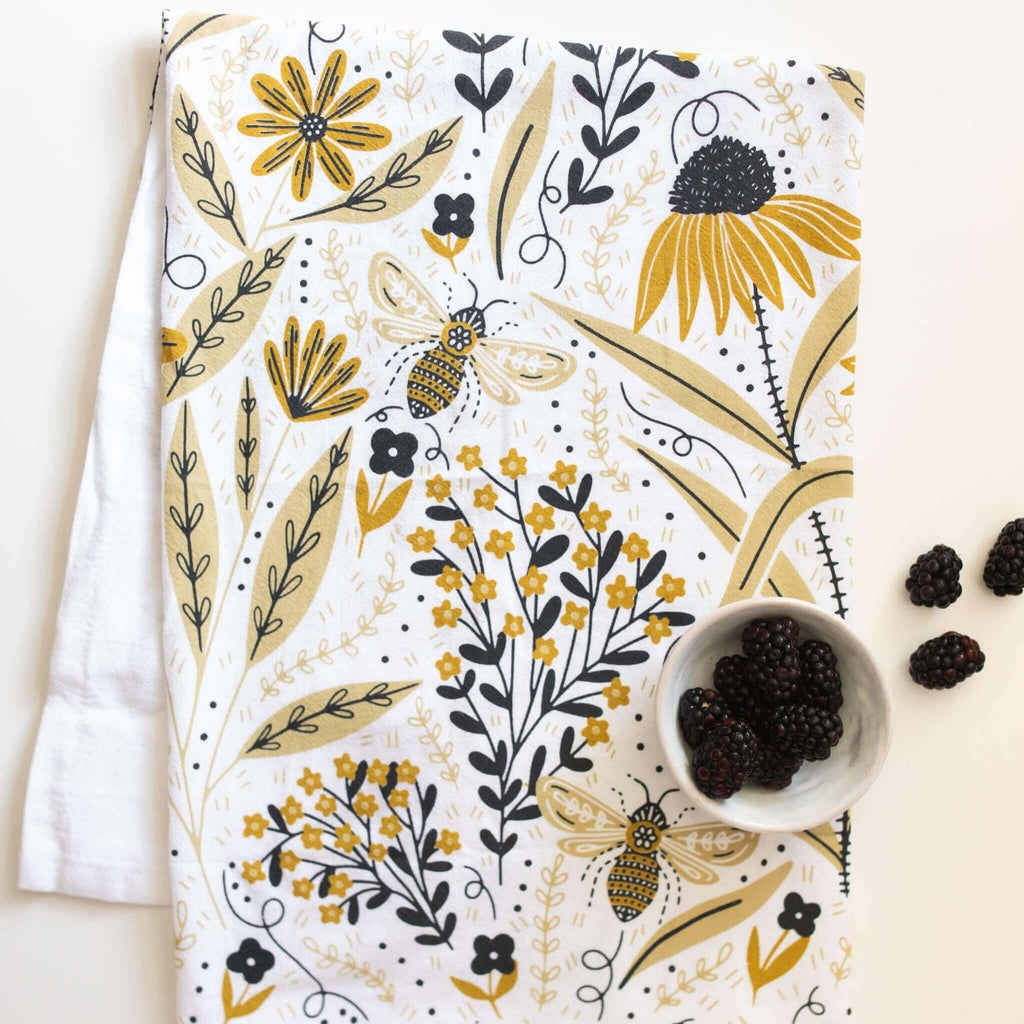 tea towel with illustrated bees and floral elements