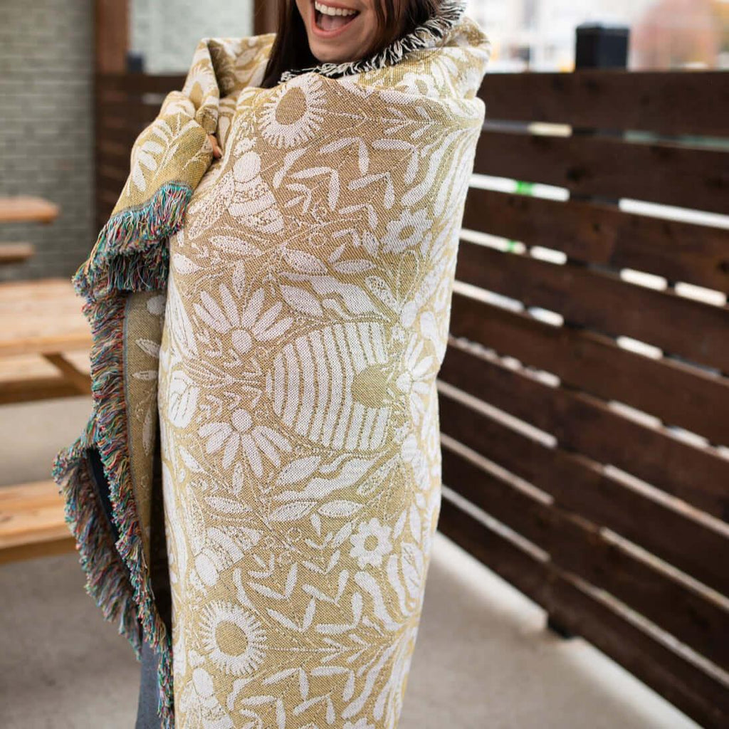 Blanket - woven throw featuring gold bee and beehive illustrations