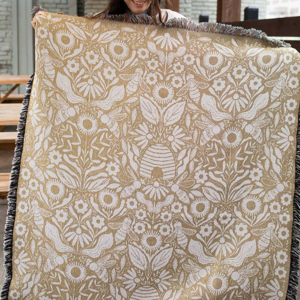 Blanket - woven throw featuring gold bee and beehive illustrations