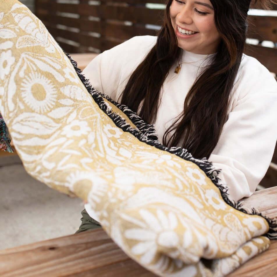 Blanket - woven throw featuring gold bee and beehive illustrations