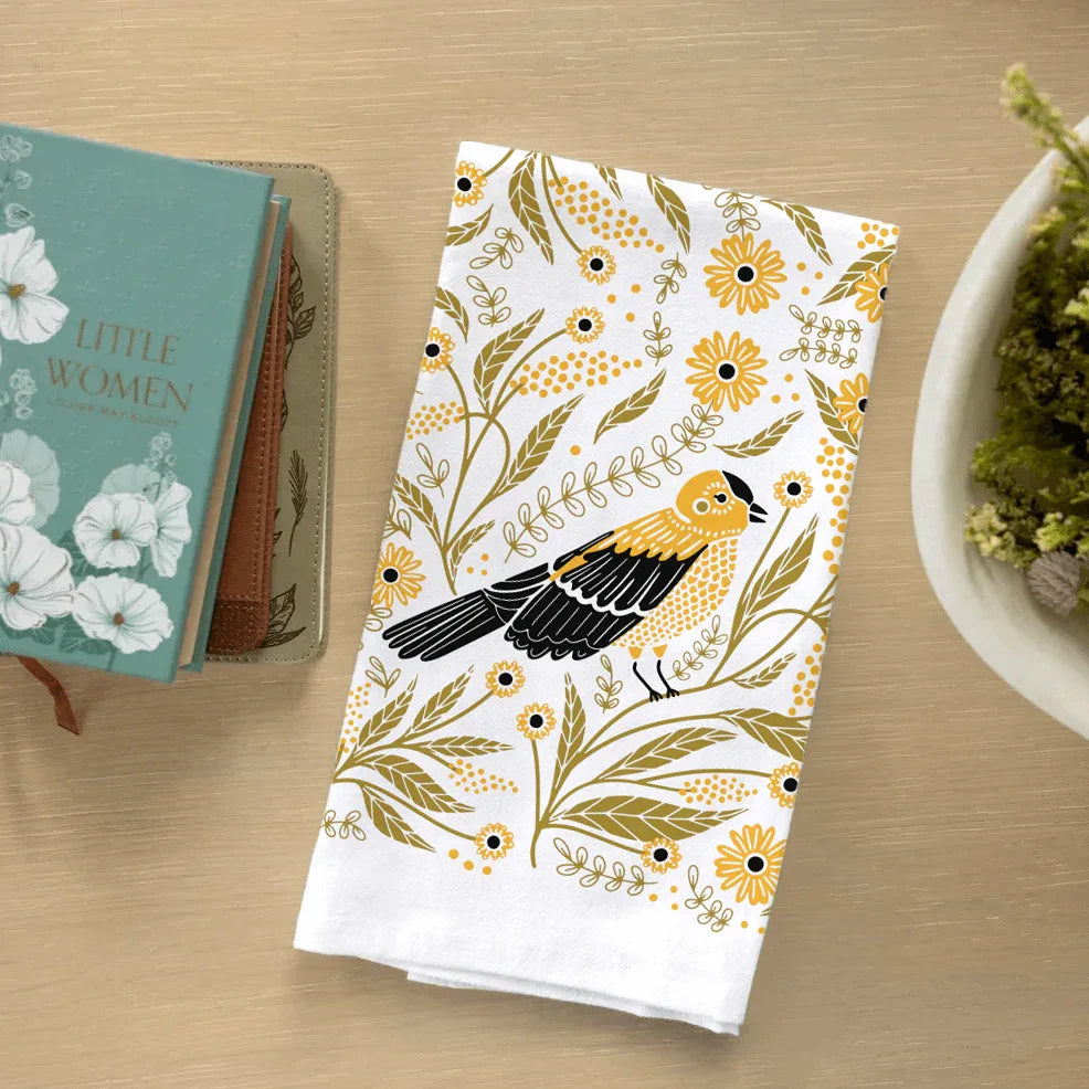 tea towel with illustrated birds and floral elements