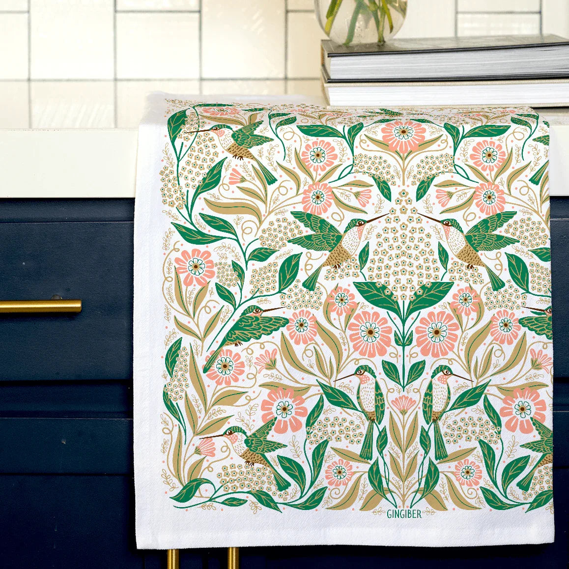 tea towel with illustrated birds and floral elements