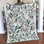 Blanket - woven throw featuring winter and forest animal illustrations on light background